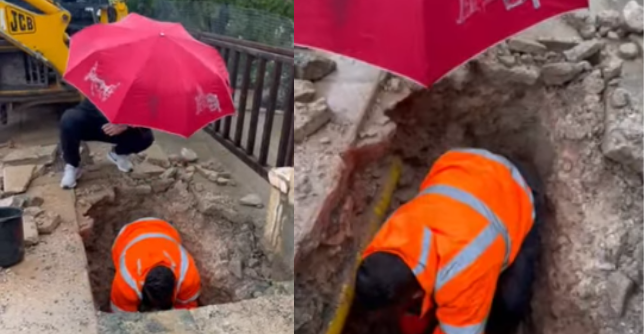 Μέσα στη βροχή και το κρύο κρατούσε την ομπρέλα για να διορθώσει ο υπάλληλος τη βλάβη: Η μικρή πράξη ανθρωπιάς που συγκίνησε μια ολόκληρη κοινότητα